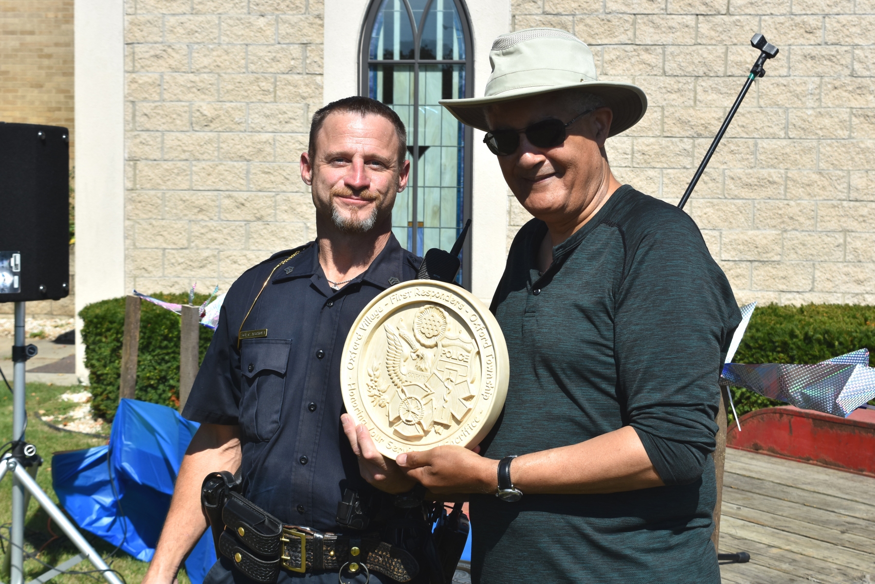 On-behalf-of-Oxford-Police-Department-Sgt.-Clint-Ascroft-accepts-an-engraved-plaque-from-Oxford-UMC-pastor-Julius-E.-Del-Pino.-Photo-by-J.-Hanlon.