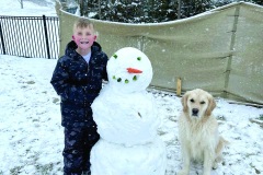 02-01-23-snow-Grayson-Mayes-8-with-his-dog-Norman