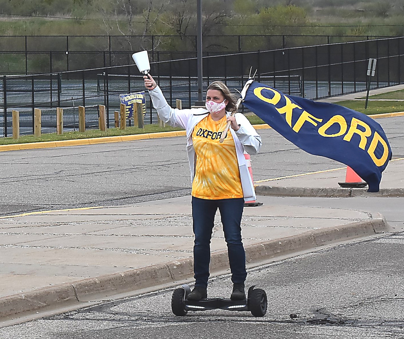 Brandishing a cowbell and banner from a segway, special education teacher Julie Beebe was the first to greet the seniors as they pulled into the parking lot.