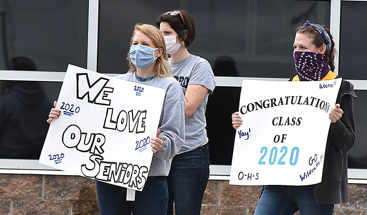 Teachers Lauren Jasinski and Kathryn Blaszczyk held signs
