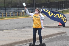 Brandishing a cowbell and banner from a segway, special education teacher Julie Beebe was the first to greet the seniors as they pulled into the parking lot.