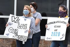 Teachers Lauren Jasinski and Kathryn Blaszczyk held signs