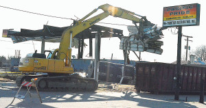 It didn’t take long for the heavy equipment to reduce the former Pacific Pride station on M-24 in Oxford to a pile of twisted metal and rubble. Photo by C.J. Carnacchio.