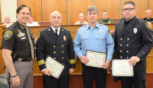 Oakland County Sheriff Michael Bouchard (from left), Addison Twp. Fire Chief Jerry Morawski, Sgt. Chuck Johnson and EMS Coordinator Rob Fitzpatrick pose during last week's National Peace Officers Day awards ceremony in Pontiac. Photo provided.