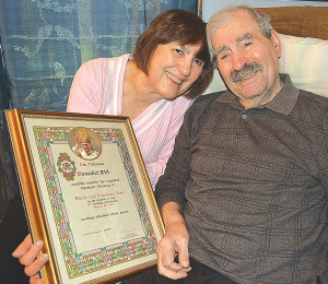 Oxford Township residents Mario and Francesca Ferri pose with the papal blessing they received for their 50th wedding anniversary in 2012. Photo by C.J. Carnacchio.