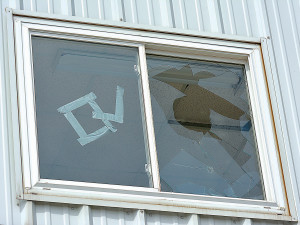 On one side, a smashed press box window. On the other, the letters “LO” were formed using duct tape, an obvious reference to Oxford’s sports rival, Lake Orion. Photos by C.J. Carnacchio.