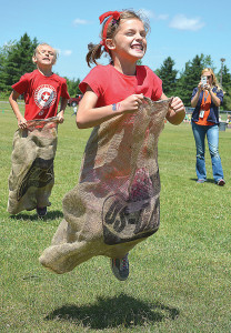 Lakeville Elementary first-grader Brooke Bourdeau has a blast competing in the sack race during the school's Field Day to celebrate the end of the school year. Photo by C.J. Carnacchio.