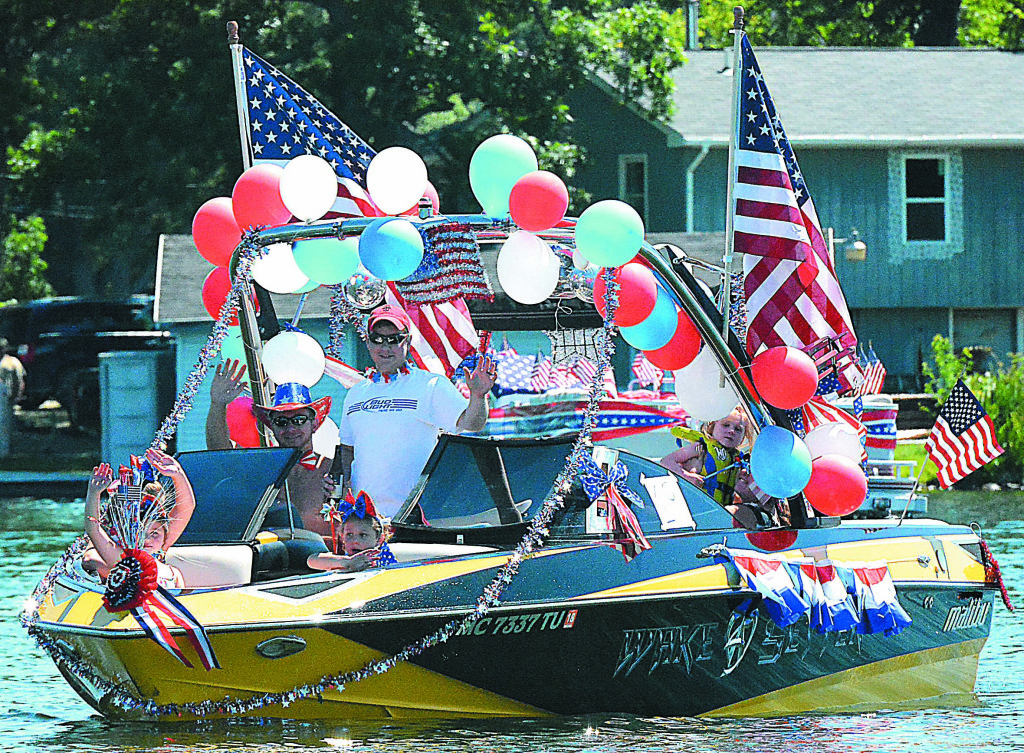 There was no shortage of balloons and flags adorning the parade entry belonging to James and Dawn Elsarelli and John Kotowicz. Photo by C.J. Carnacchio