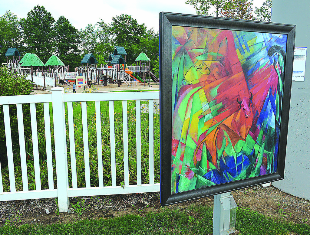 Sitting outside the Kids Kingdom playground at Seymour Lake Township Park is a reproduction of German artist Franz Marc's 1914 painting entitled "Animals in a Landscape." The painting is one of eight masterpieces currently on display around Oxford as part of the Detroit Institute of Arts' Inside/Out program. Photo by C.J. Carnacchio.