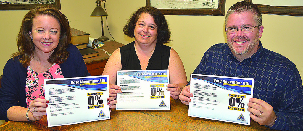 Oxford parents Julie Fracker (from left), Erica DiCosmo and Korey Bailey will be distributing campaign literature promoting Oxford Schools' non-homestead operating millage proposal on the Nov. 8 general election ballot. Photo by C.J. Carnacchio.