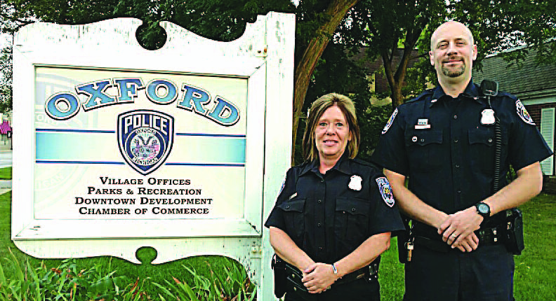Oxford Village Police Officers Paula Grech (left) and James Owens were honored last week for saving the life of a resident in full cardiac arrest. Photo provided.