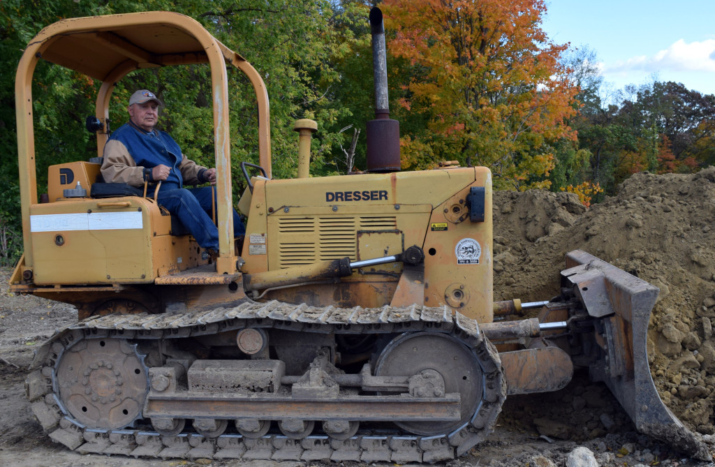 Earl Caron, of Addison, has donated his driving a bulldozer to make the sled hill a reality. Photo by Elise Shire.