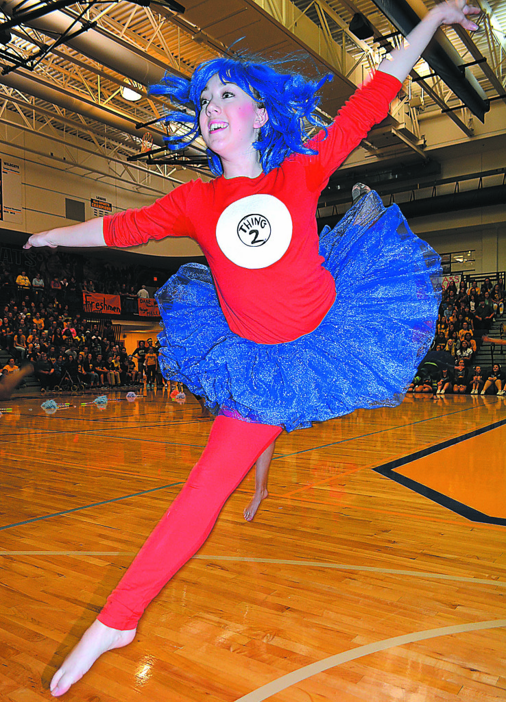 Ashley Zardus dances as Dr. Seuss character “Thing 2” as part of a routine performed by the Oxford Dance Conservatory. The stories and characters created by children’s author Dr. Seuss were used as this year’s homecoming theme.