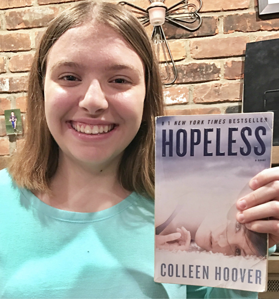 OHS junior Elizabeth Marshall holds a copy of "Hopeless" by Colleen Hoover.