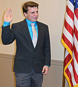 Newly-elected Addison Township Trustee Jacob Newby takes the oath of office.