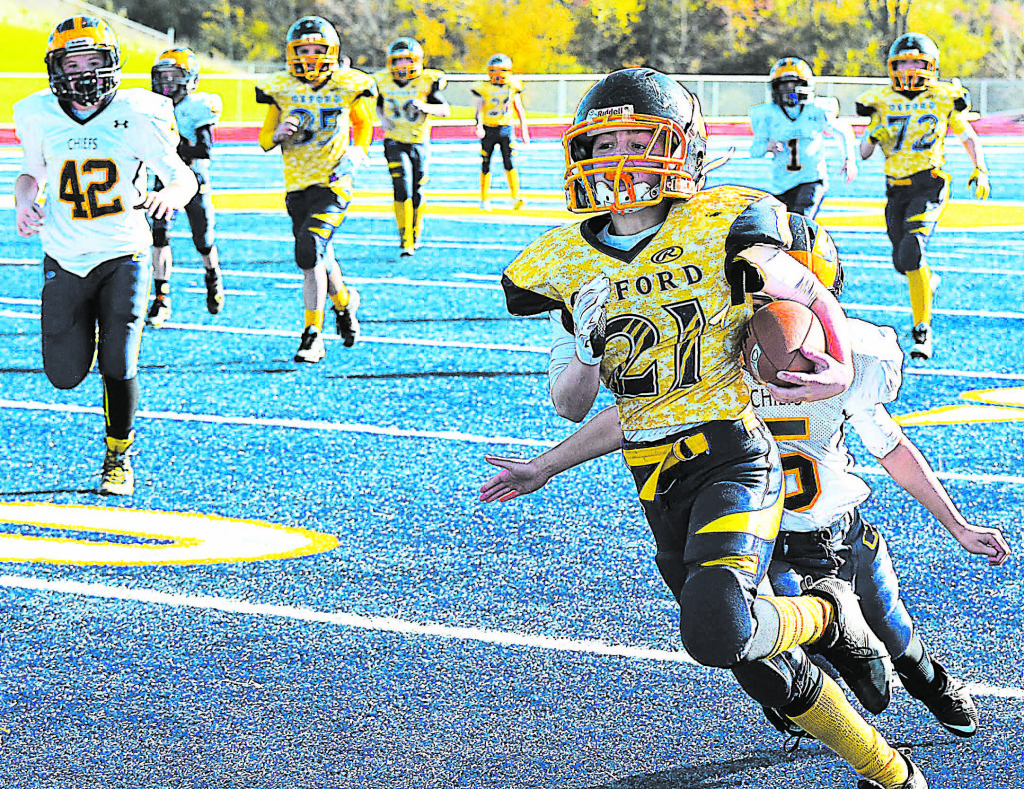 Oxford's John Asciutto played a great game. He scored both of the Jr. Wildcats' touch-downs as they played Clarkston Saturday in the Northern Youth Football League Super Bowl. Photos by C.J. Carnacchio.