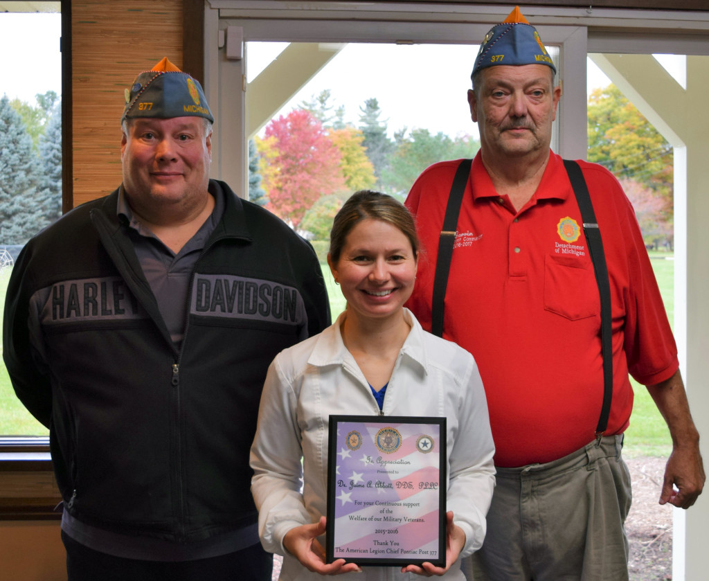 David West (from left) from Post 377 in Clarkston, Dr. Jaime Abbott and J.A.S. Commander Carvin (Huey) Chapman. Dr. Abbott received a plaque honoring her support of veterans. Photo by Jim Newell.