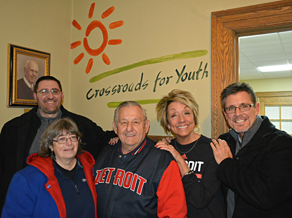 Hilary Maciejewski (center), the very first resident of Camp Oakland, returned Dec. 10 to visit the 320-acre campus, now called Crossroads for Youth. He’s flanked, to the left, by his wife Connie and Crossroads President Marc Porter, and, to the right, by Special Projects Director Karen Gully and Clinical Director Chris Veihl. Photo by C.J. Carnacchio.
