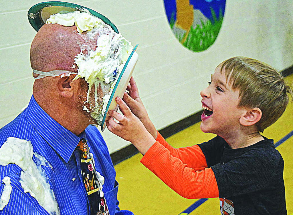Ian Hafeli was one of 26 lucky Daniel Axford Elementary students who got to smoosh cream pies in the face of Principal Chad Boyd. That looks sticky.