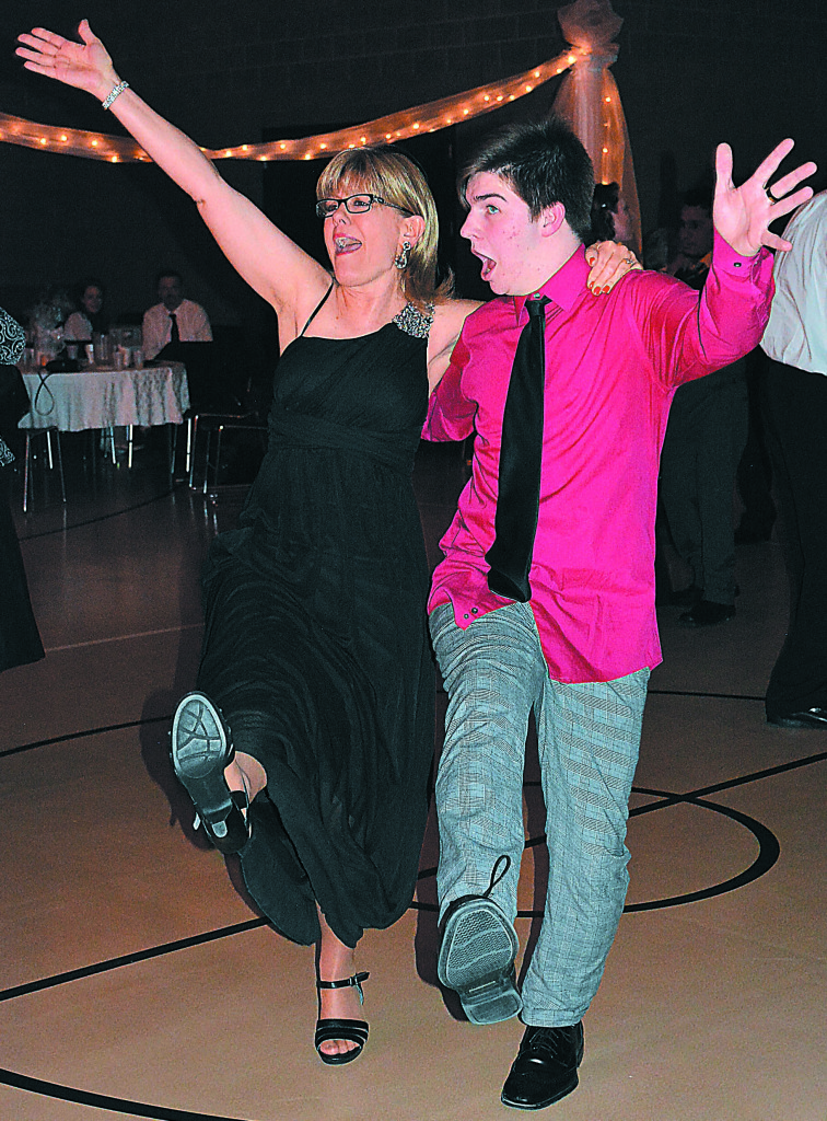 Kicking up their heels to the classic tune “New York, New York” are Teresa Rolland (left), of Lapeer, and Mark Snider. Snider was all over the dance floor that night.