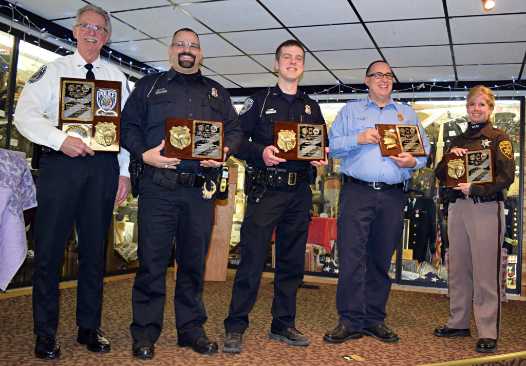 Honored with awards from American Legion Post 108 were (from left) Oxford Village Police Chief Mike Neymanowski, Reserve Cpl. David Zanin, Officer Sean Brown, Oxford Fire Sgt. Kelly Kilgore and Oakland County Sheriff’s Deputy Amy Wakerly. Photo by Elise Shire. 