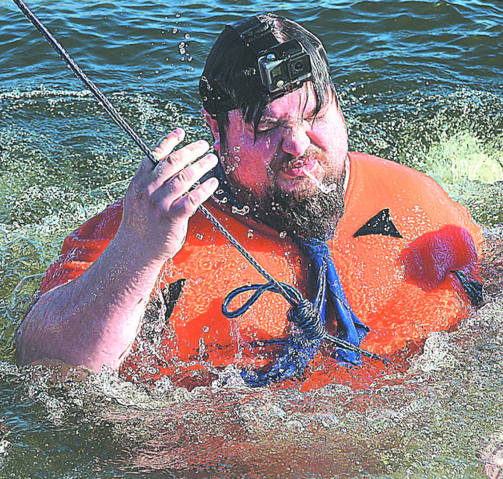 On Saturday afternoon, Jason Judkins, treasurer of Rochester-North Oakland Elks Lodge #2225, plunged into the icy water of a local lake dressed as classic cartoon character Fred Flintstone. 