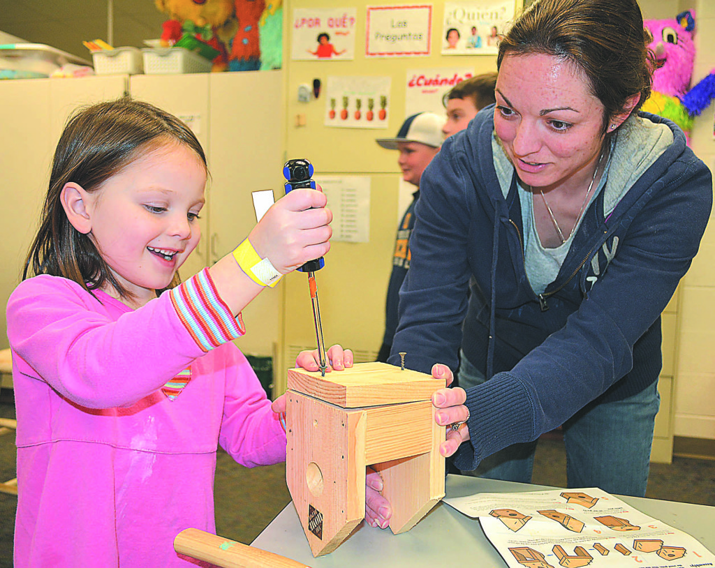 Oxford resident Kristen McFadden, 5, has fun building a birdhouse with mom, Stephanie. Home Depot provided all the kits and tools for the little projects. Photo by C.J. Carnacchio.