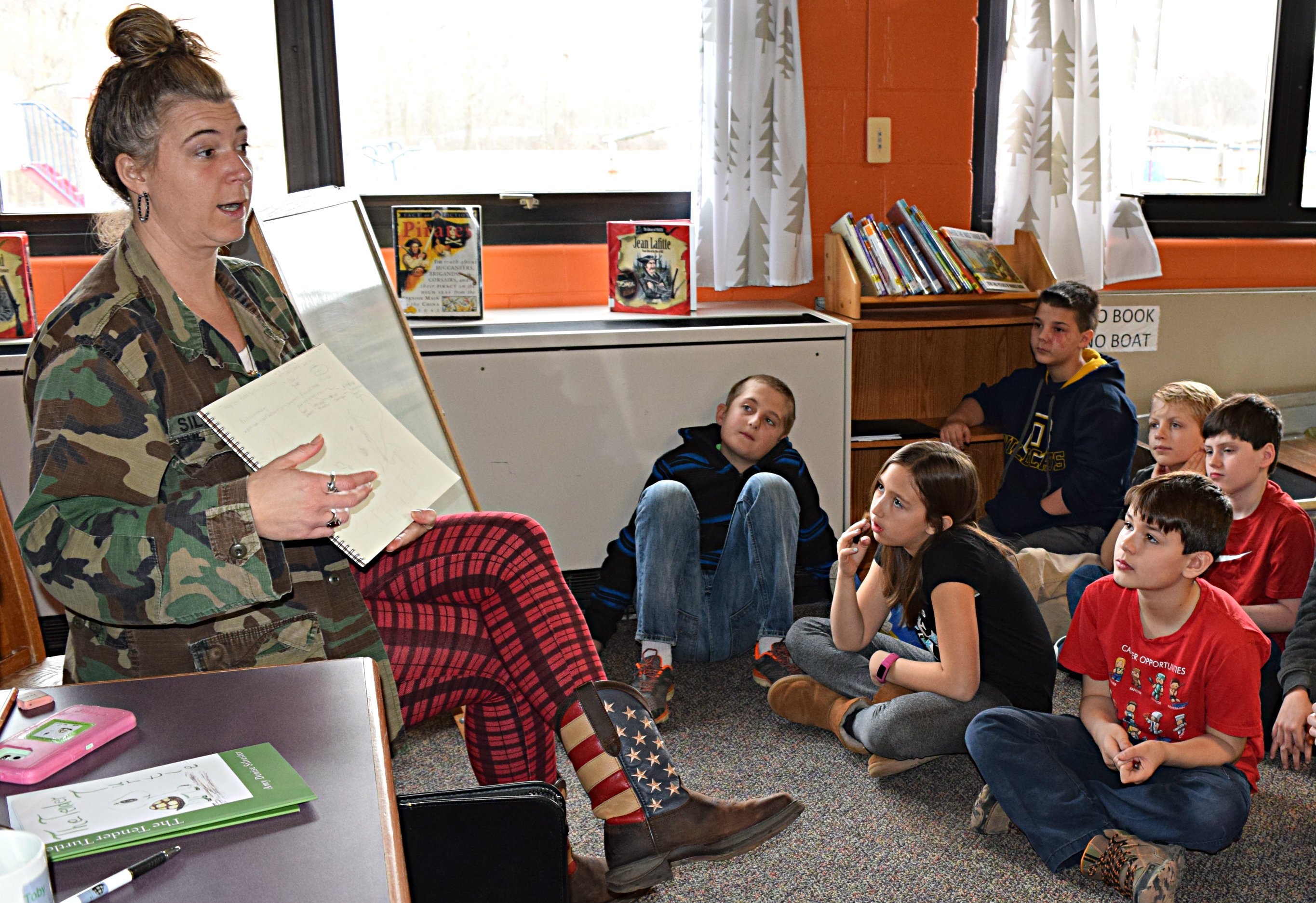 Children’s author/illustrator Amy Silvester (left) discusses story ideas with Leonard Elementary students during her March 24 visit to the school. Photo by Elise Shire.
