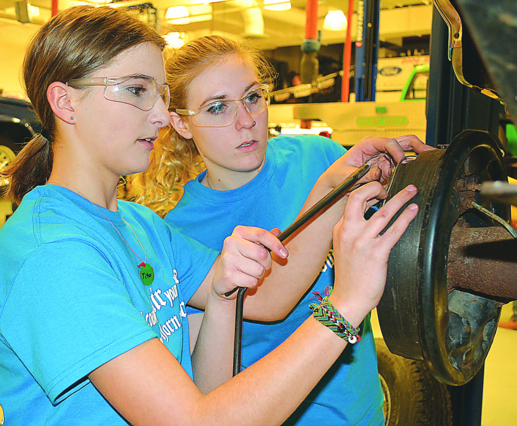 OHS auto technology students Natalie Beethem (left) and Serenity Grant took second place in the brake competition. They wore special, matching t-shirts identifying themselves as “Balsley’s Bodacious Brake Babes.”