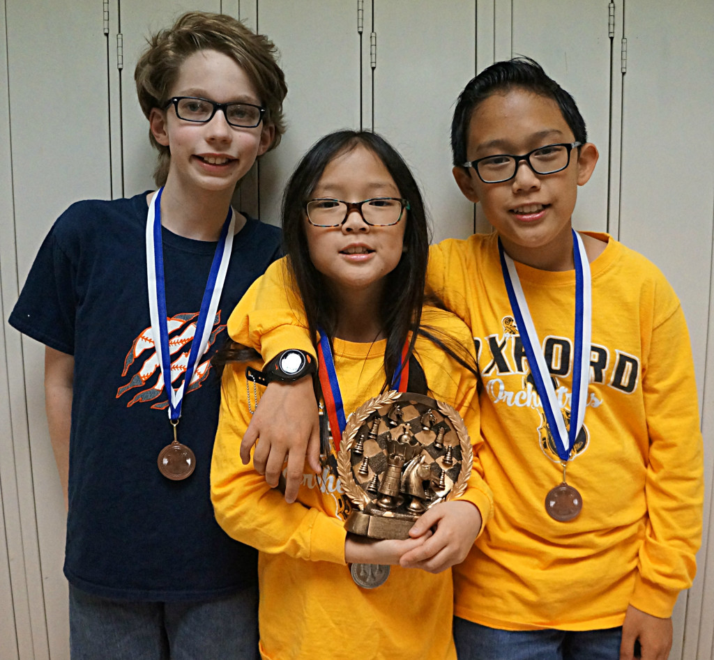 Chess Club members (from left) Dale Schmalenberg, Michael Duong and Jenna Duong walked away with medals at a recent tournament.