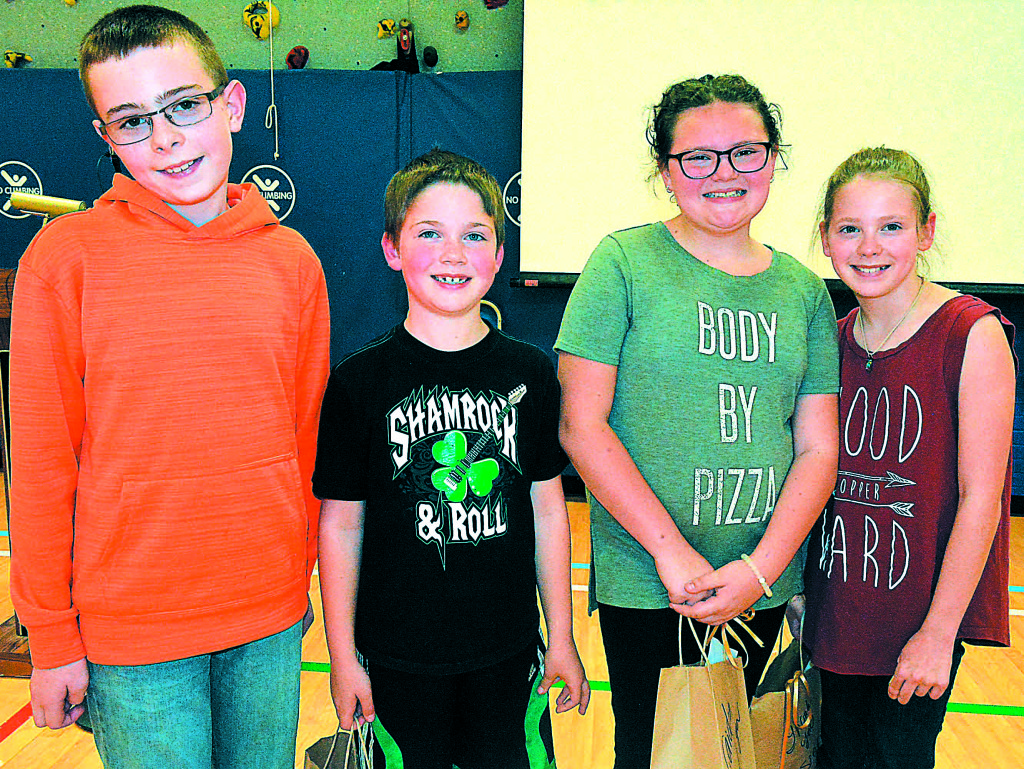 Oxford Middle School sixth-grader Wyatt Ashley (far left), a former Leonard student, mentored the kids who raised money for this year’s goat project. The top donors in the school were Elijah Wright (from left), Jaiden Hatchew and Sierra Musial. 