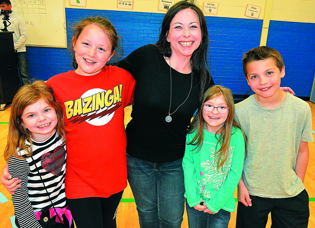 Surrounded by her actors and actresses is Lauren LoCascio (center), founder of the Leonard Elementary Theatre Club and director of The Lion King KIDS. Pictured (from left) are Peyton McDevitt, Sarah Phelps, Riley McDevitt and Finn McDevitt.