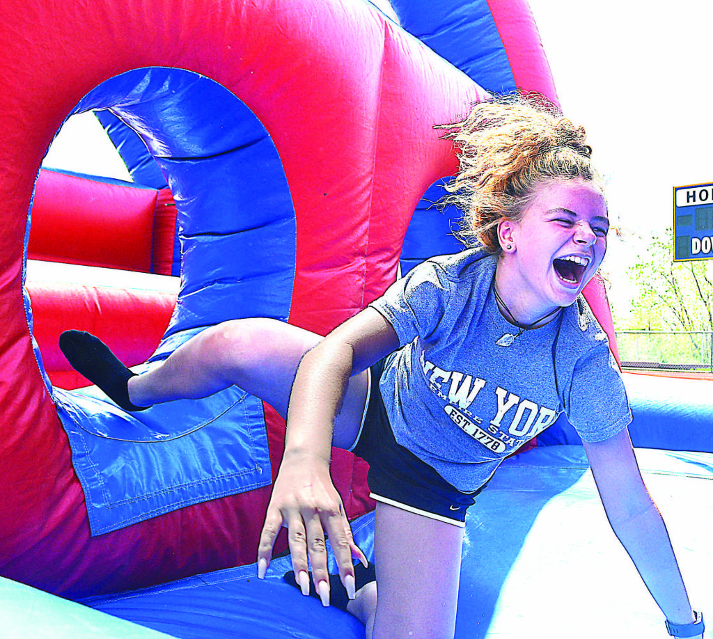 OHS freshman Amelia Libby has fun tackling the inflatable obstacle course.