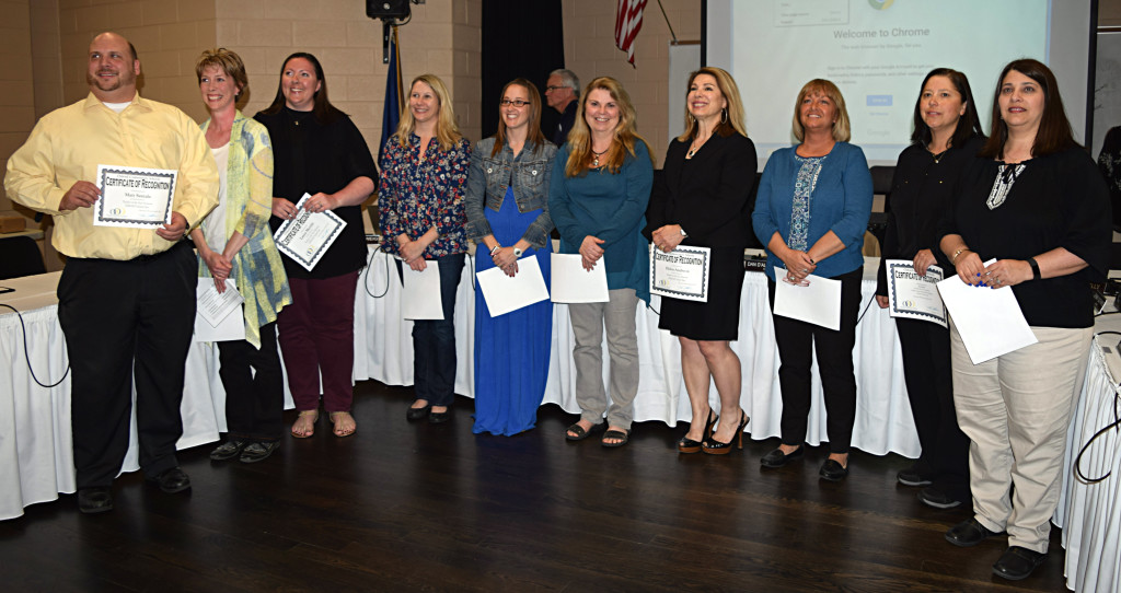 Matt Santala (from left), Melissa Peruski, Laura Merritt, Robin Graft, Kerry Cisneros, Judy Bozinski, Helen Andreou, Stacy Ruch, Sue Roeher, and Catherine Guy accepted their nominations at a recent Oxford Board of Education meeting. Photo by Elise Shire.
