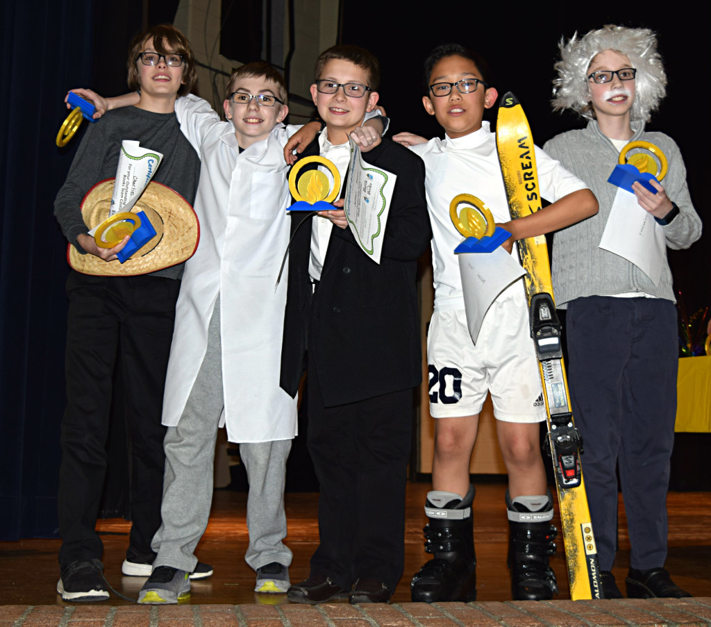 Sixth-graders Charlie Fletcher (from left), Jackson Brandt, Drake Krawczyk, Michael Duong and Dale Schmalenberg show off their trophies following their big victory at the OMS Battle of the Books last week. Photo by Elise Shire.