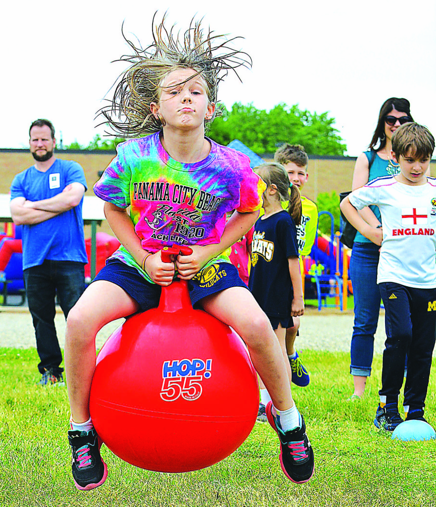 First-grader Riley Zyngier races down the field on a hopper ball.