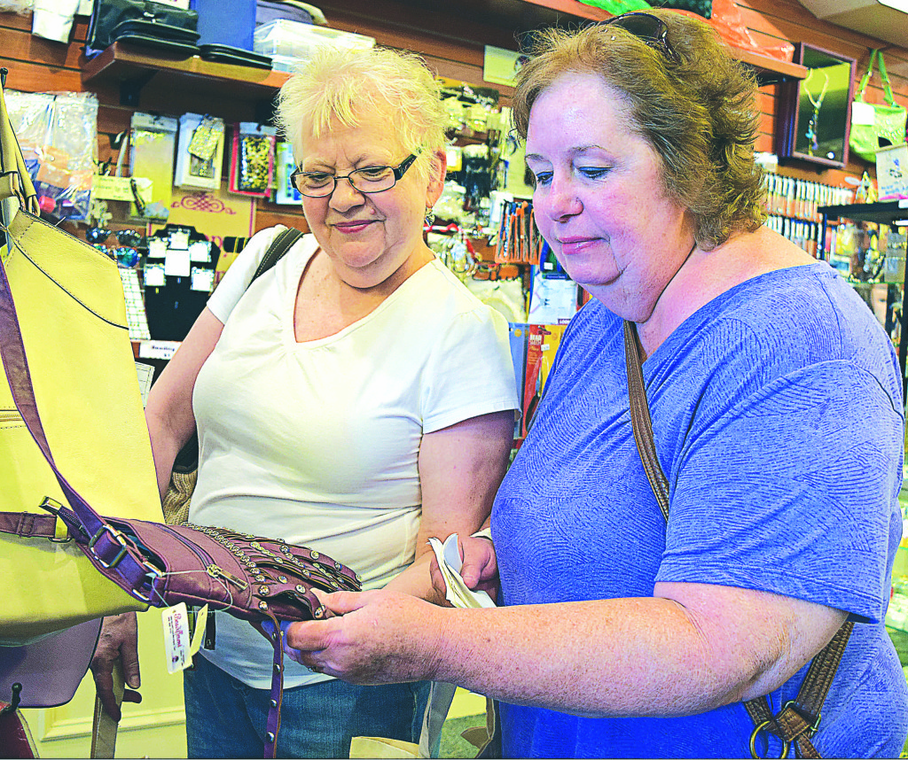 Longtime best friends Mary Marion, of Redford (left), and Jackie Kuebler, of Oxford, bond through shopping at downtown’s Beadifferent.