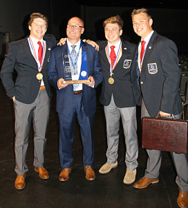 Benn Nuss (left), DECA Advisor Steve Ruch, Sergio Borg, and Rick Galbraith pose for a photo after the competition.