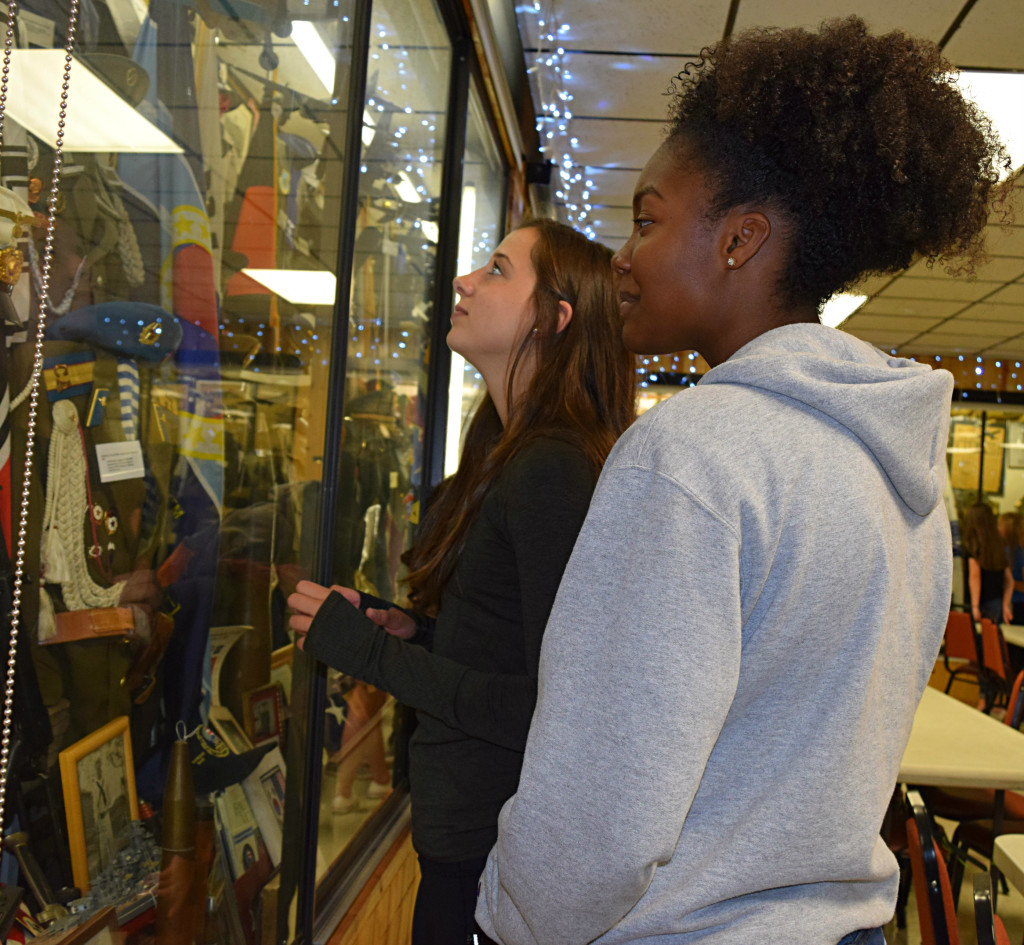 Alani Contreras and Melissa Normand view military artifacts. Photo by Elise Shire.