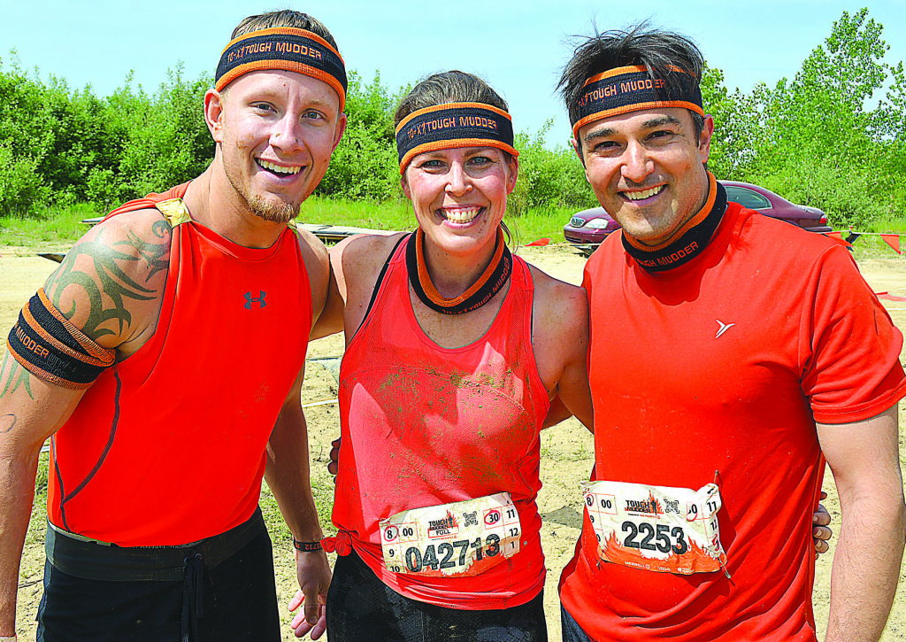 All smiles after completing the Tough Mudder are (from left) Derek Brenner, of Chesterfield, and Oxford residents Stacy and Mario Ray. Photo by C.J. Carnacchio.