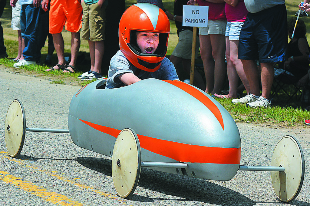 Leonard Elementary third-grader Emery Jones races down W. Elmwood St. during the Strawberry Derby.
