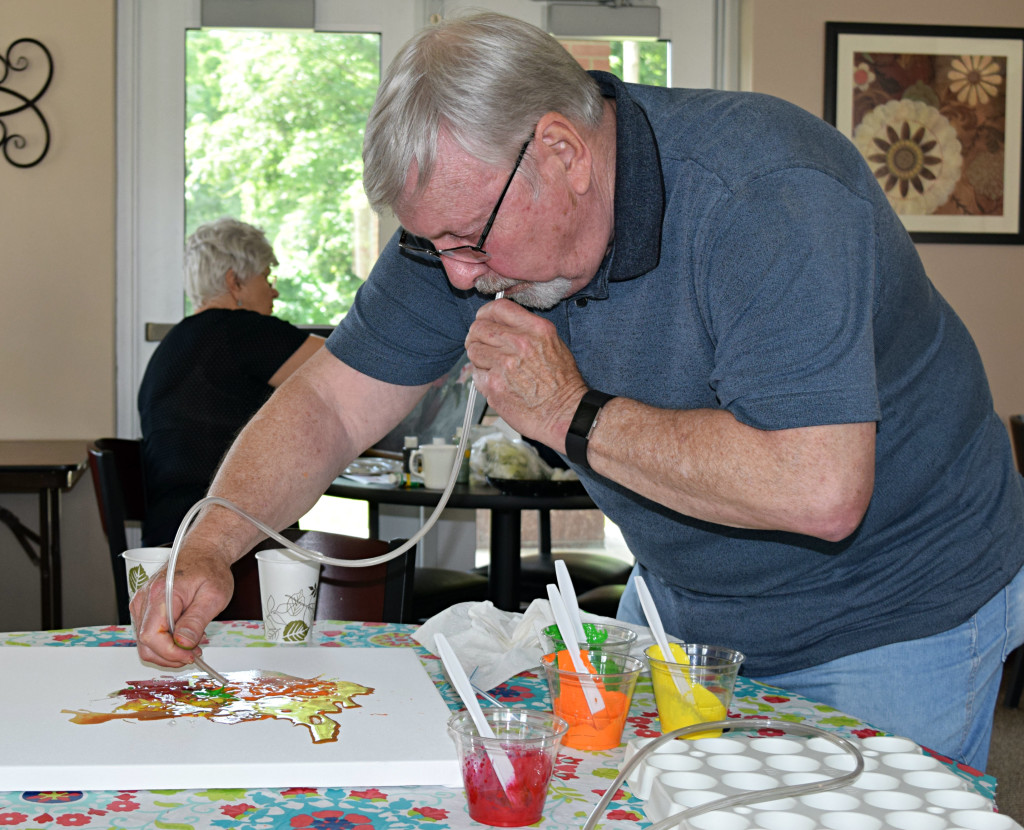 Jerry Thomas demonstrates his blow painting technique.