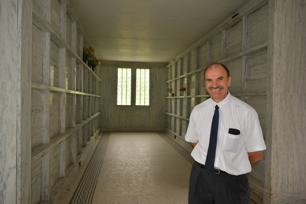 Oxford Twp. Clerk Curtis Wright stands inside the mausoleum built in 1924. Photo by CJC.