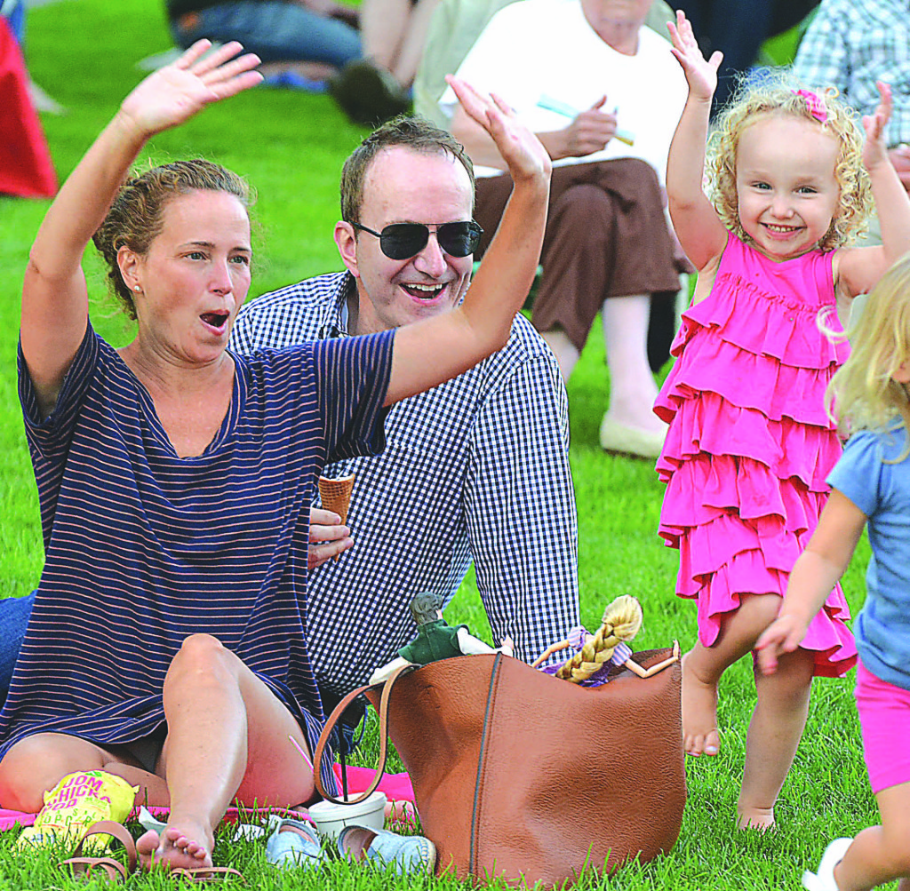 The Flaherty family of Oxford enjoys the concert. Pictured are (from left) Susan, Michael and little Evie, 3. Photo by C.J. Carnacchio.