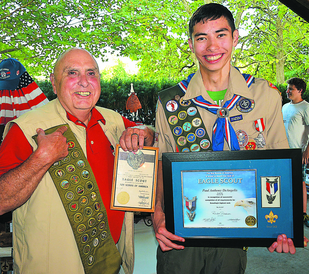 OHS junior Paul DeAngelis (right) received his Eagle Scout certificate and medal during an Aug. 17 Court of Honor ceremony at Christ the King Church. With him is his grandfather, Vincent Paul DeAngelis, who became an Eagle Scout 59 years ago. Photo by CJC.