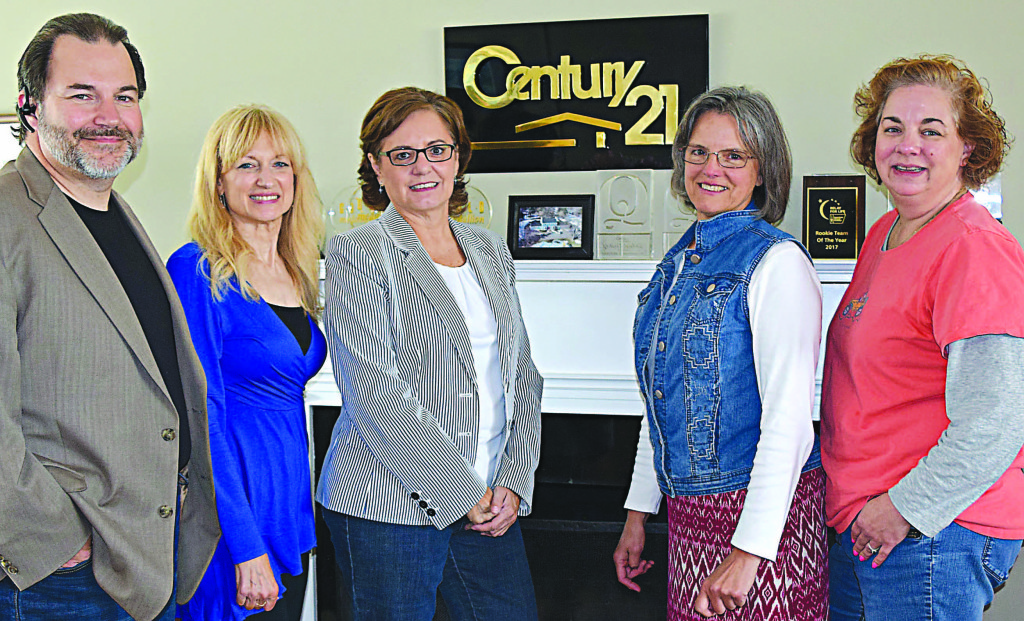 Managing Broker Jack Tubbs (far left) and Century 21 Affiliated staff pose at the Oxford office, located at 850 S. Lapeer Rd., where supplies will be collected to benefit victims of Hurricane Harvey. Photo by Elise Shire.