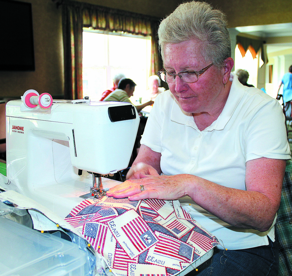 Dryden Township resident Karen Angell works away on her sewing machine. Photo by C.J. Carnacchio.