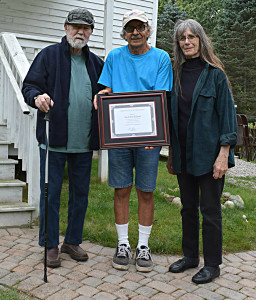Joe and Pat Schnur (left and right) received a certificate of appreciation from Addison Parks Committee Co-Chairman Chuck Peringian. Photo by Elise Shire.