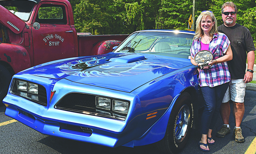 Leonard resident Stephanie Persico (left) won first place in the classic car category with her 1978 Trans Am. With Stephanie is her husband Dwayne Persico. Photo by Elise Shire.
