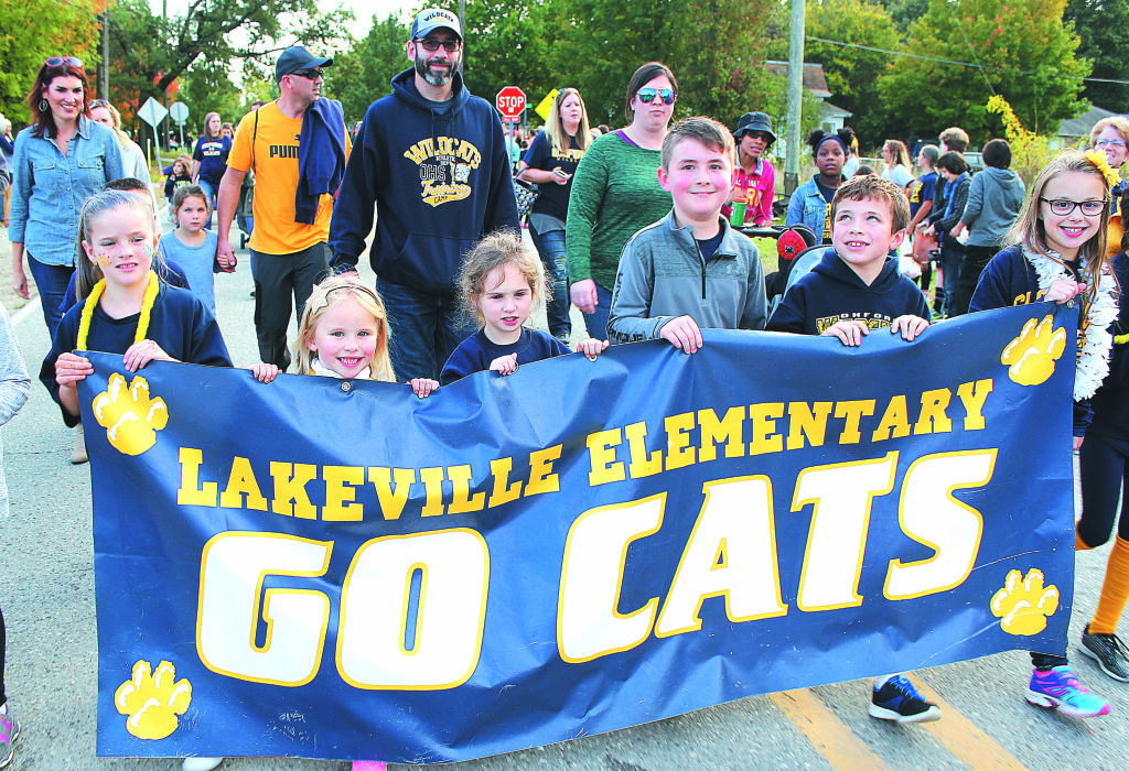 Carrying the banner for their school are Lakeville Elementary students (from left) Isabella Spezia, Brook Edwards, Jersey Recker, Evan Luth, Peyton Faucett and Skye Nahas. Photo by C.J. Carnacchio.